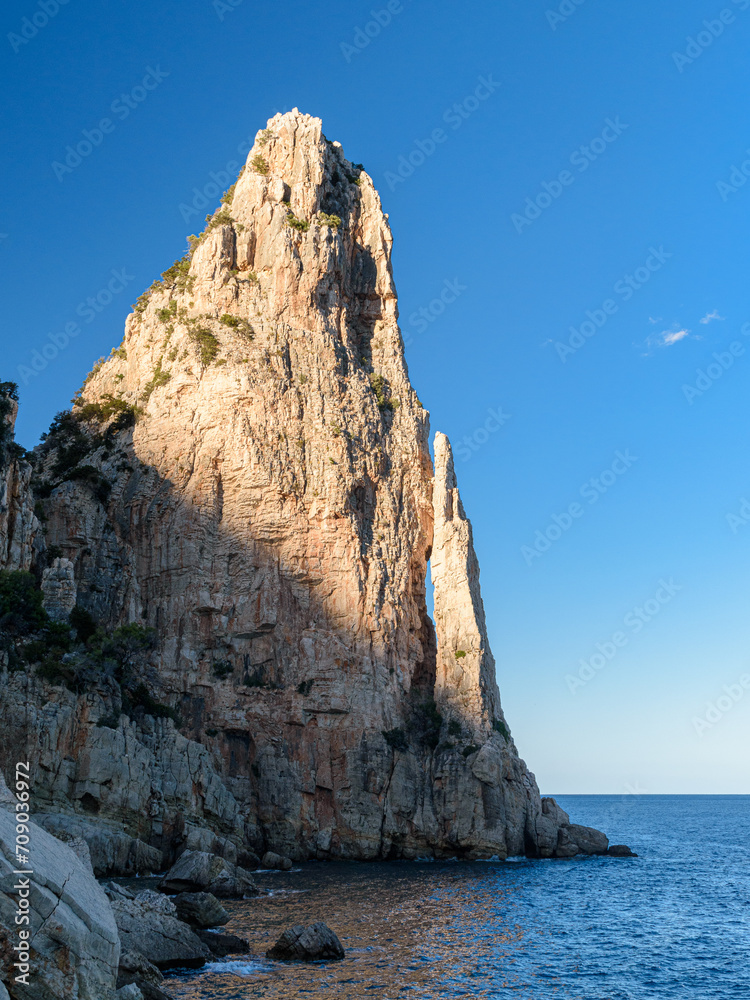 Rock limestone pinnacle called Pedra Longa in the Orosei gulf near Santa Maria Navarrese, small sea village in Ogliastra in east Sardinia