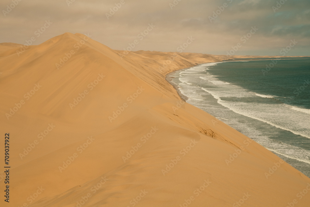Ocean meets the Sand dunes in Sandwich Harbour Historic, Namibia