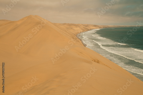 Ocean meets the Sand dunes in Sandwich Harbour Historic  Namibia