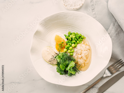 Aspic or Kholodets. Smoked carp aspic served with greens and pike caviar. White chicken meat or fish in aspic with vegetables. Tasty fish or meat in jelly gelatin. Top view. Delicious food background photo