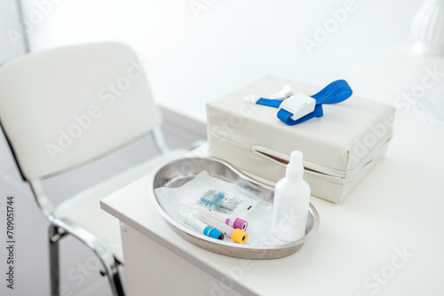 The desktop of a medical worker or nurse. Blood collection devices on a white table. photo
