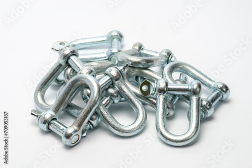 Group of extra-hard D-Rings Shackles to connect towing and lifting elements. White background.