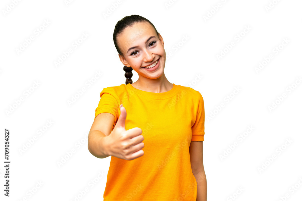 Young Arab woman over isolated background with thumbs up because something good has happened Young Arab woman over isolated background with thumbs up because something good has happened