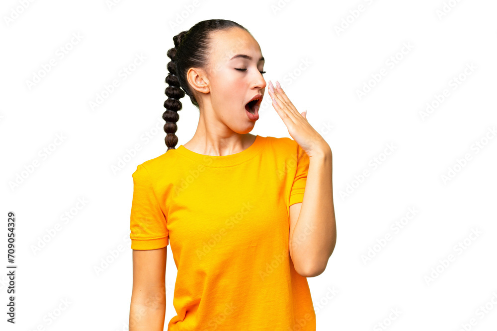 Young Arab woman over isolated background yawning and covering wide open mouth with hand Young Arab woman over isolated background yawning and covering wide open mouth with hand