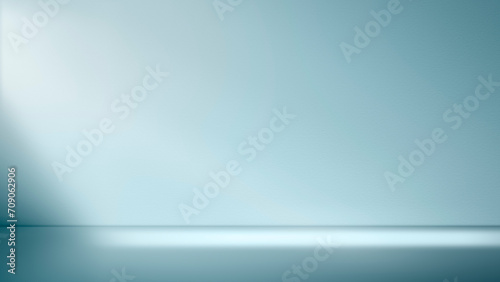abstract minimal light blue background for product presentation. Shadow and light from windows on plaster wall.