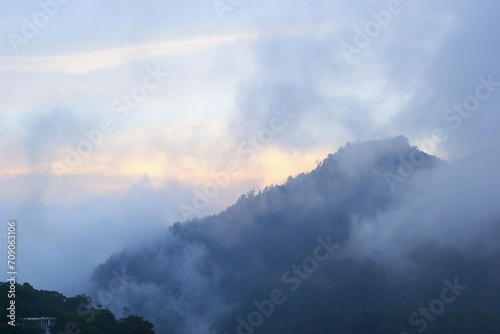 time clouds over the mountains on sunset © Irfan_setiawan