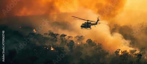 helicopter douses bush fire