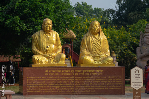 Picture of statues of Goenkas who built the Pagoda Vipassana centre of Mumbai.Dalai Lama, Buddhism, people, spiritual, pilgrimage, golden statue, meditation, jainism photo