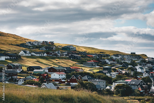 small village at the faroe islands under a cloudy sky