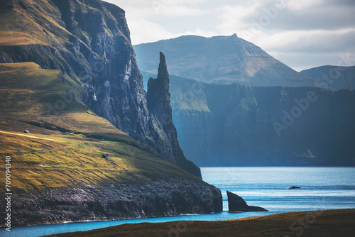 landscape with cliffs by the ocean at faroe islands