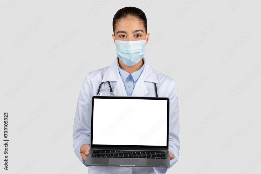 Professional european doctor in a white lab coat and protective face mask Professional european doctor in a white lab coat and protective face mask