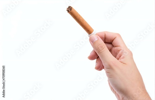a hand holding a cigarette vertically isolated on white background