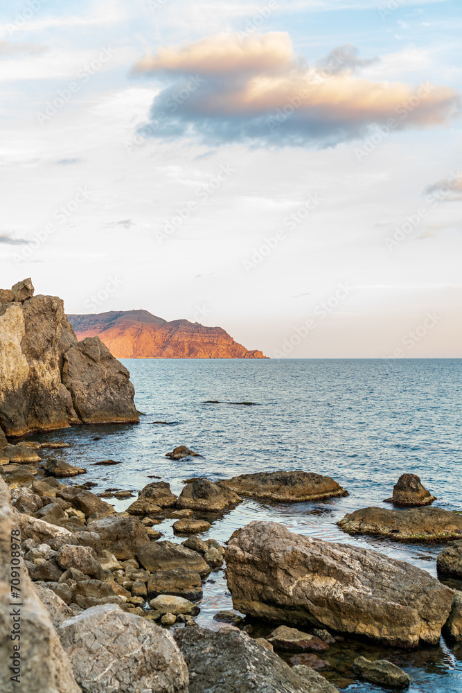 Sudak, Crimea. Cape Rybachy. Mount Meganom in the light of the setting sun