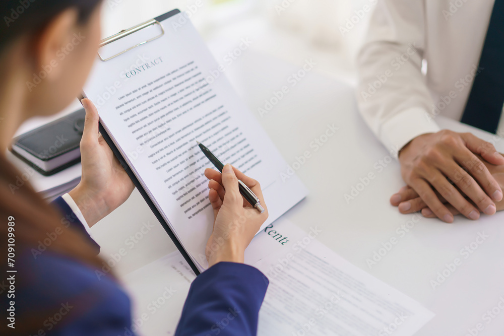 Lawyer woman explaining business contract and giving consultation legal agreement with businessman Lawyer woman explaining business contract and giving consultation legal agreement with businessman
