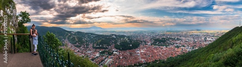 Brasov, Transylvania. Romania. Aerial panoramic view of the old town and Council Square, Aerial twilight cityscape of Brasov city