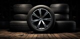 Stack of black tires in photo on black background. generative AI