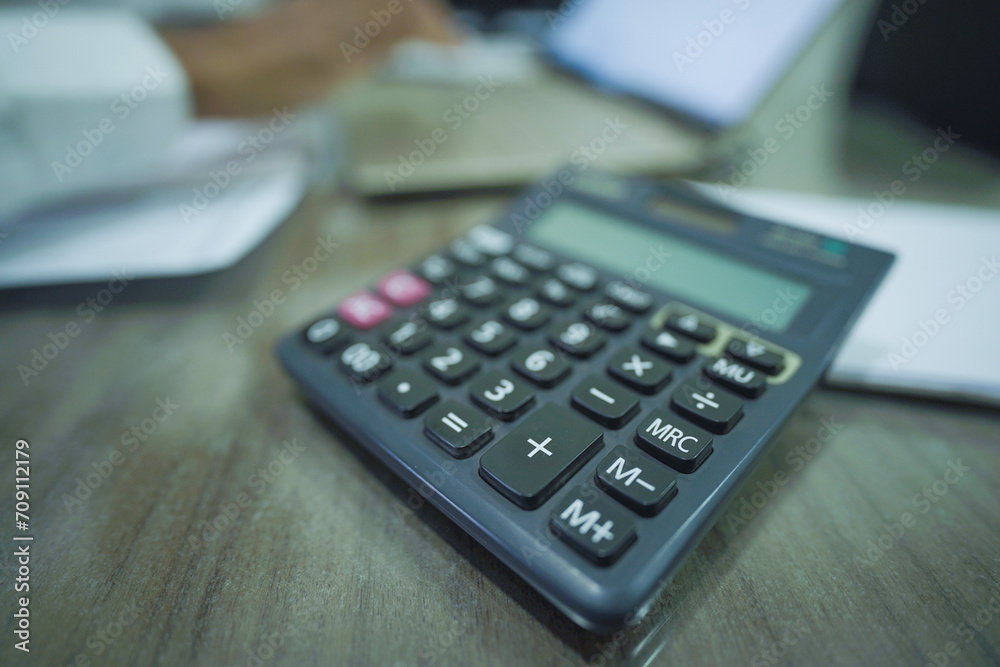 Business calculator on office table, Office table with business planning with calculator, Close Up Calculator On Office Table Stock Photo Business calculator on office table, Office table with business planning with calculator, Close Up Calculator On Office Table Stock Photo