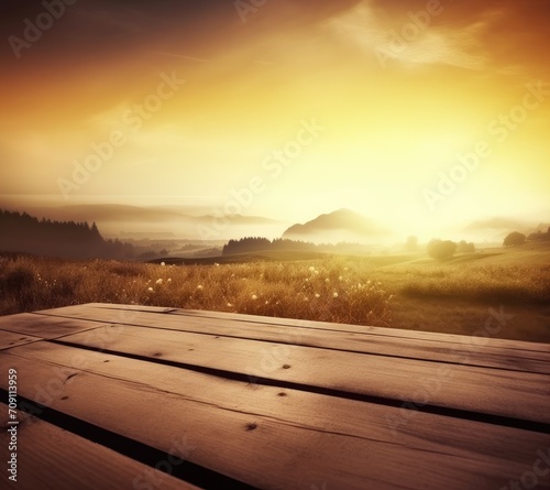 empty vintage table for product display montage with golden sunrise over misty hills