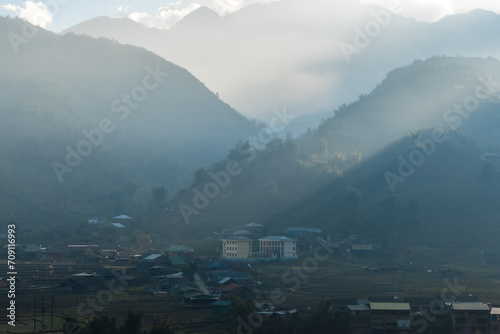 Muong Hoa Valley, located about 8km southeast of Sapa town, Vietnam. It's famous for its green rice terraces or golden rice paddies along with majestic mountain and forest photo