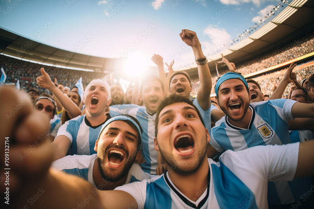 Argentine soccer fans supporters in stadium - obrazy, fototapety, plakaty 