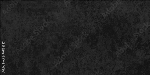 Black asphalt texture close up of texture concrete textured metal surface.interior decoration,grunge surface blurry ancient paintbrush stroke earth tone,fabric fiber cloud nebula.
