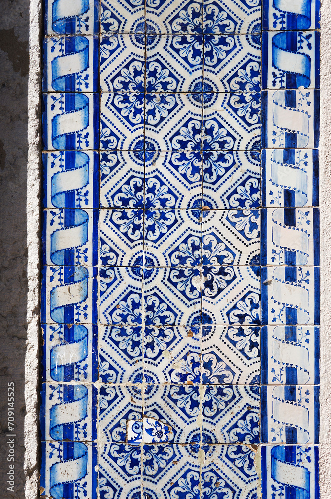 Old Medieval Azulejo Tiles on Building Wall in Alfama District, Lisbon, Portugal.