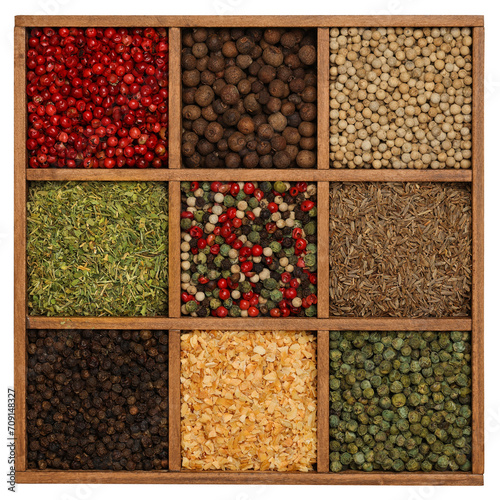Wooden box of assorted spices isolated © breakingthewalls