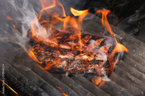 Searing and smoking ribeye steaks on grill