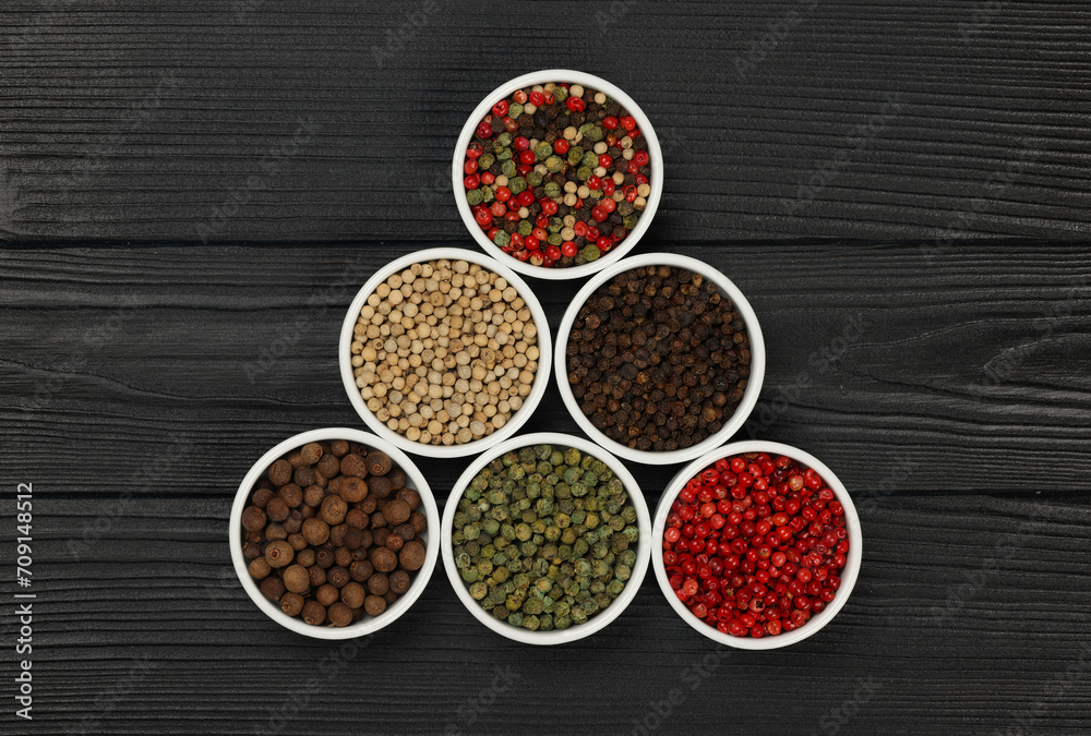 Triangle of assorted peppercorns in bowls