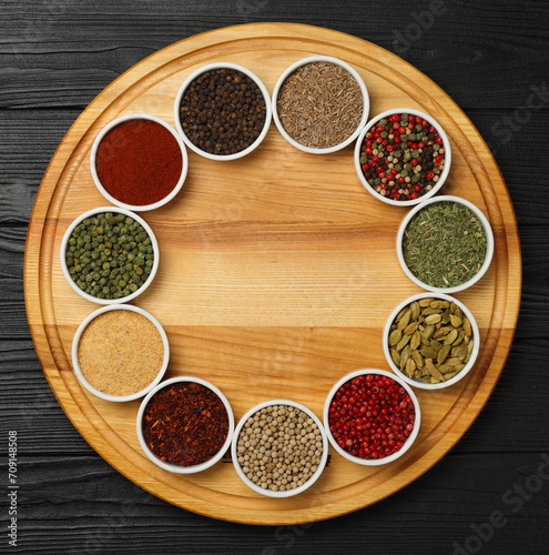 Circle of assorted spices in bowls