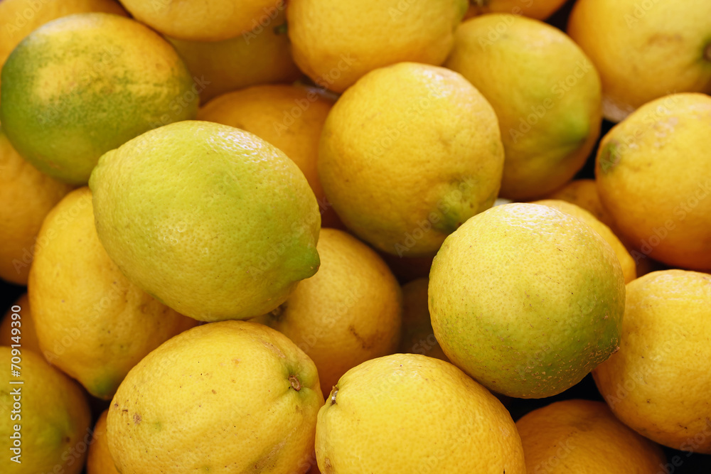 Fresh yellow lemons on market stall Fresh yellow lemons on market stall