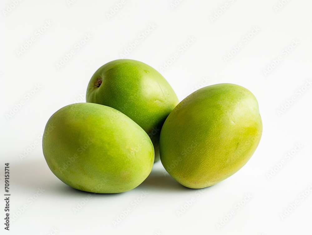 Fresh green tropical mangoes isolated on white background. Minimalist style.
Fresh green tropical mangoes isolated on white background. Minimalist style.