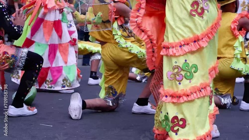 During the annual celebration of the coconut festival, street dancers in various local and native costumes perform in a frenzy along the street to pay homage to a Patron Saint. photo