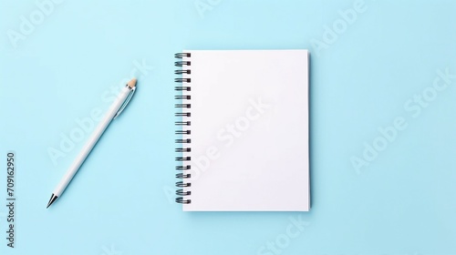Minimalist Workspace with Blank Notebook and Pencil on Pastel Blue Background – Ideal for Creativity and Design Concepts in Modern Offices and Artistic Blogs