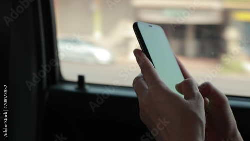 person using mobile phone in car  photo