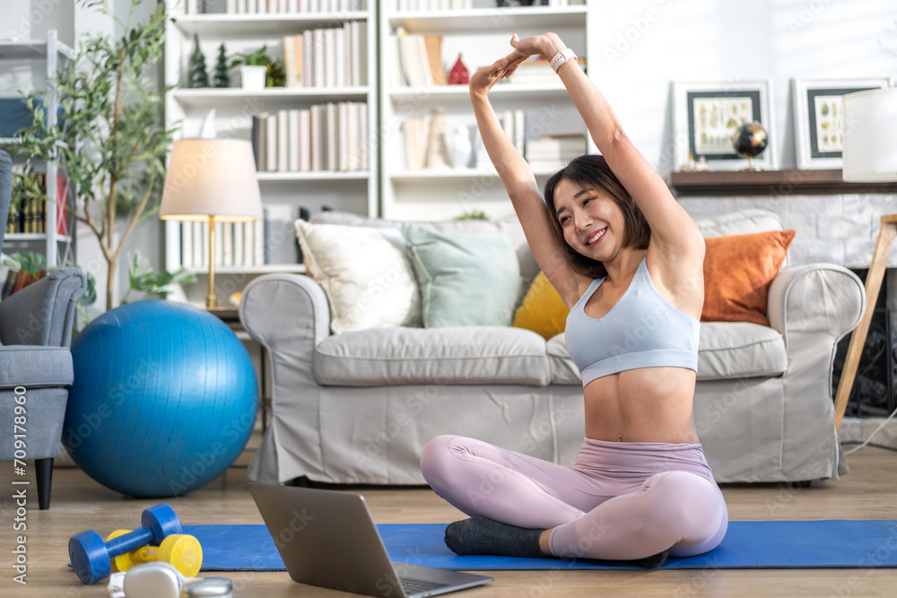 Obraz premium Portrait of sport slim fit strength asian woman training in sportswear sitting relax and practicing yoga, fitness, exercise, wellness, workout, sport at home.Diet concept.Fitness and healthy lifestyle