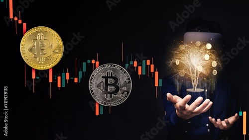 Investor of bitcoin market with cryptocurrency flowing out from device in his hand in a dark background with a candle chart an coins photo