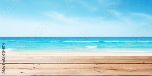 Summer-themed wooden table display with a blue sea background. © Sona