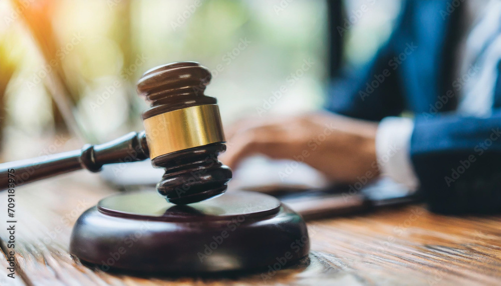 gavel resting on a wooden block, symbolizing authority and justice in a legal setting gavel resting on a wooden block, symbolizing authority and justice in a legal setting