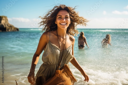 A stunning woman coming out of the water at a beach.