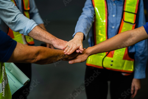 Hands of businessmen and engineers work together to create a successful project teamwork concept. senior contractor and intelligent architect smiling to work together