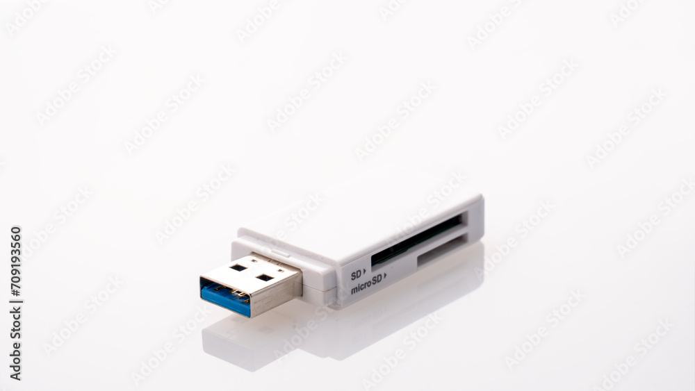 Flash card reader on white background Close-up, adapter SD to USB, microSD to USB Flash card reader on white background Close-up, adapter SD to USB, microSD to USB