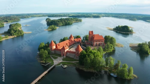 Aerial footage of Trakai Castle on summer morning. Lakes and islands around. TRAKAI, LITHUANIA - 07 11 2023 photo