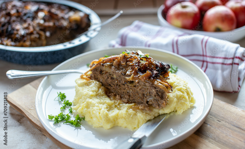 Delicious swedish meatloaf with cabbage and mashed potatoes on a plate