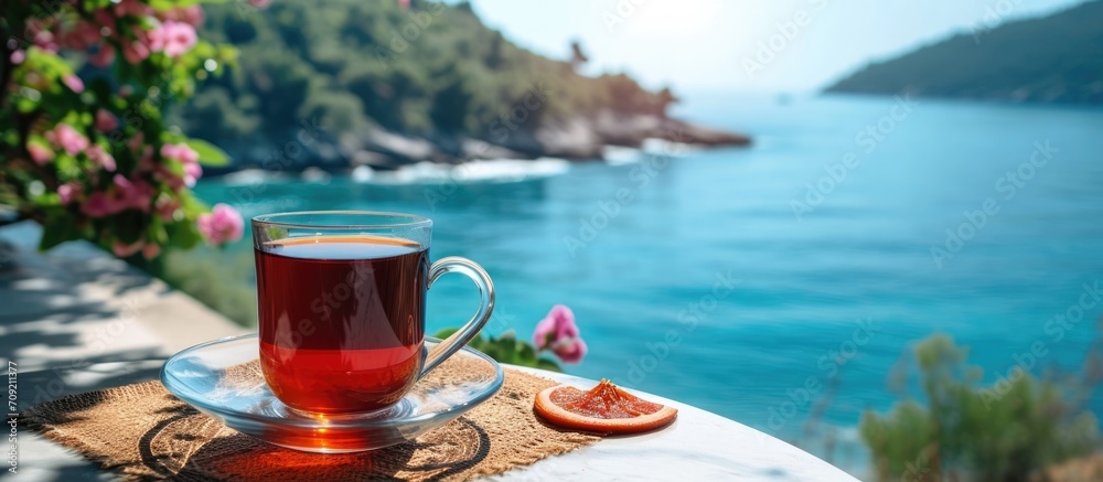 Enjoying Turkish tea with a scenic view on a sunny vacation day
