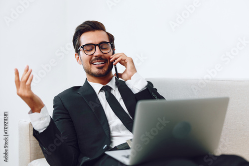 Businessman man phone video talk call office happy sofa smile winner laptop computer