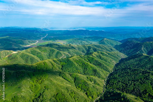 Drone view on forested mountain peaks, beautiful valleys, wildlife of Kazakhastan