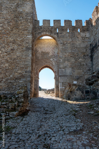 View of the entrance gate to the castle of Jimena de la Frontera, a beautiful village in the province of Cadiz, Andalusia, Spain.