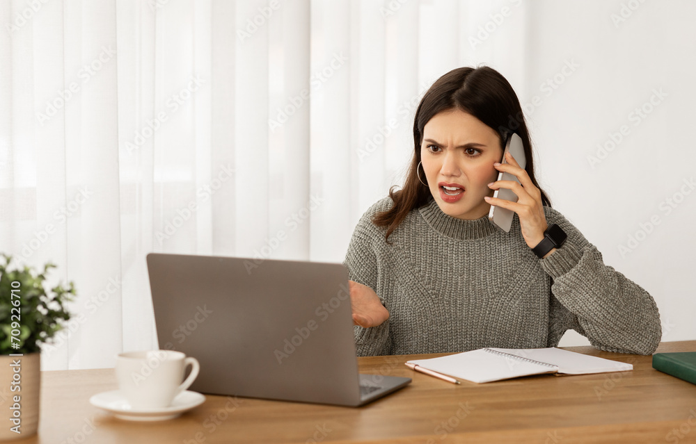 Angry young businesswoman have phone conversation with assistant Angry young businesswoman have phone conversation with assistant