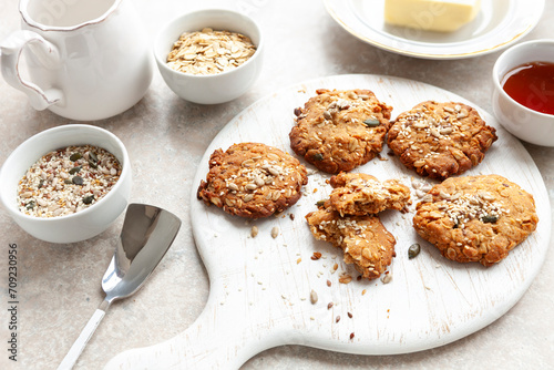 Traditional homemade oatmeal cookies with sesame and sunflower seeds and ingredients for baking them